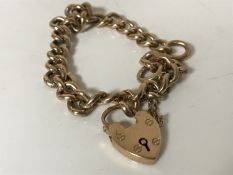 A 9ct gold padlock bracelet CONDITION REPORT: 11.