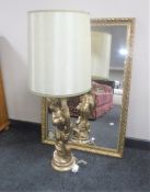 A gilt framed bevelled mirror together with a gilt chalk table lamp and shade