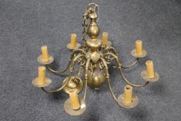 A continental brass eight branch chandelier
