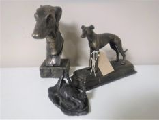 Two cast iron figures of greyhounds and a figure of puppy