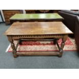 An antique carved oak table bearing date 1670,
