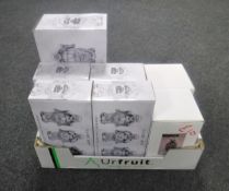 A box containing boxed ornaments to include five boxed Leonardo Collection silver art buddhas,