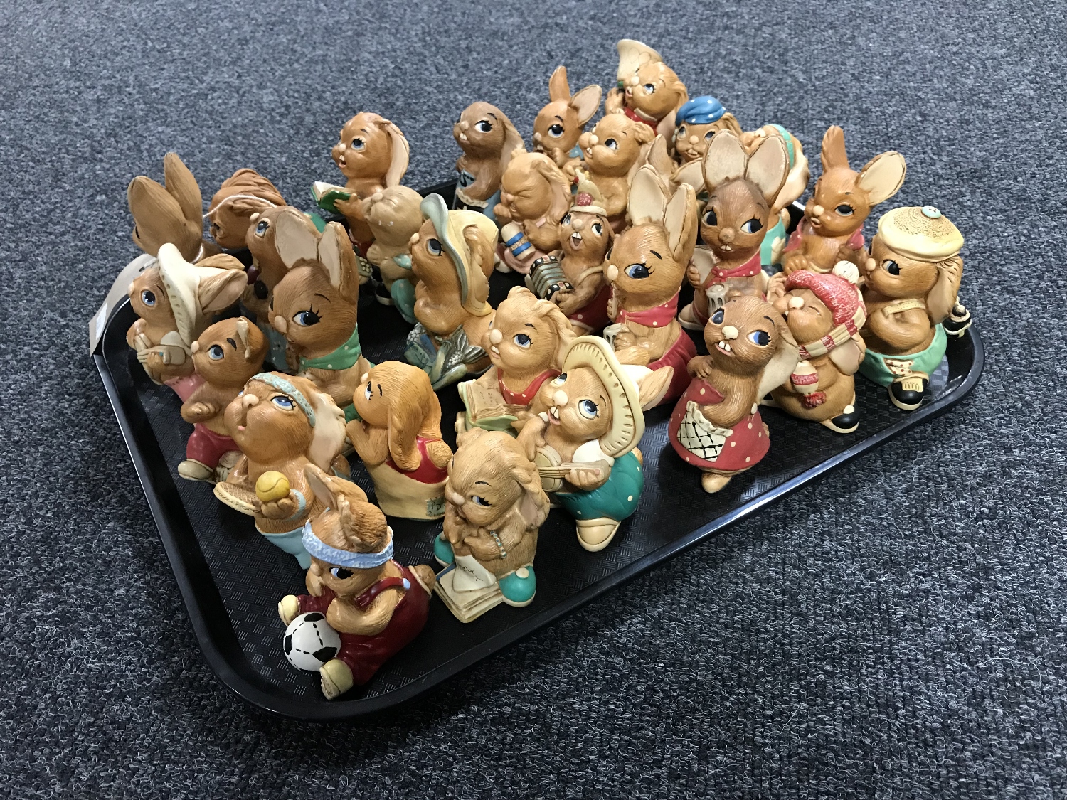 A tray of thirty assorted Pendelfin rabbit figures