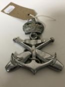 A vintage Royal Navy car badge