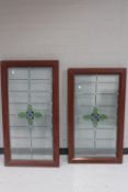Two UPVC framed stained leaded glass windows
