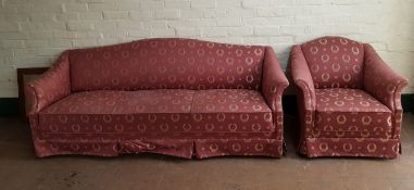 An early 20th century continental three seater settee and armchair in classical upholstery