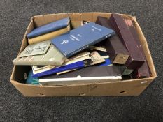 A box of RAF radio and TV vintage books together with pianola rolls