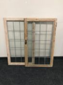 A pair of antique pine leaded glass doors