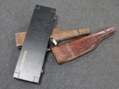 A Winchester gun case together with two antique leather shoulder o' mutton gun cases