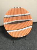 A 1960's woven wicker basket chair on metal legs