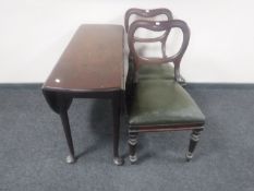 An early Victorian mahogany drop leaf table on club feet together with a pair of mahogany balloon