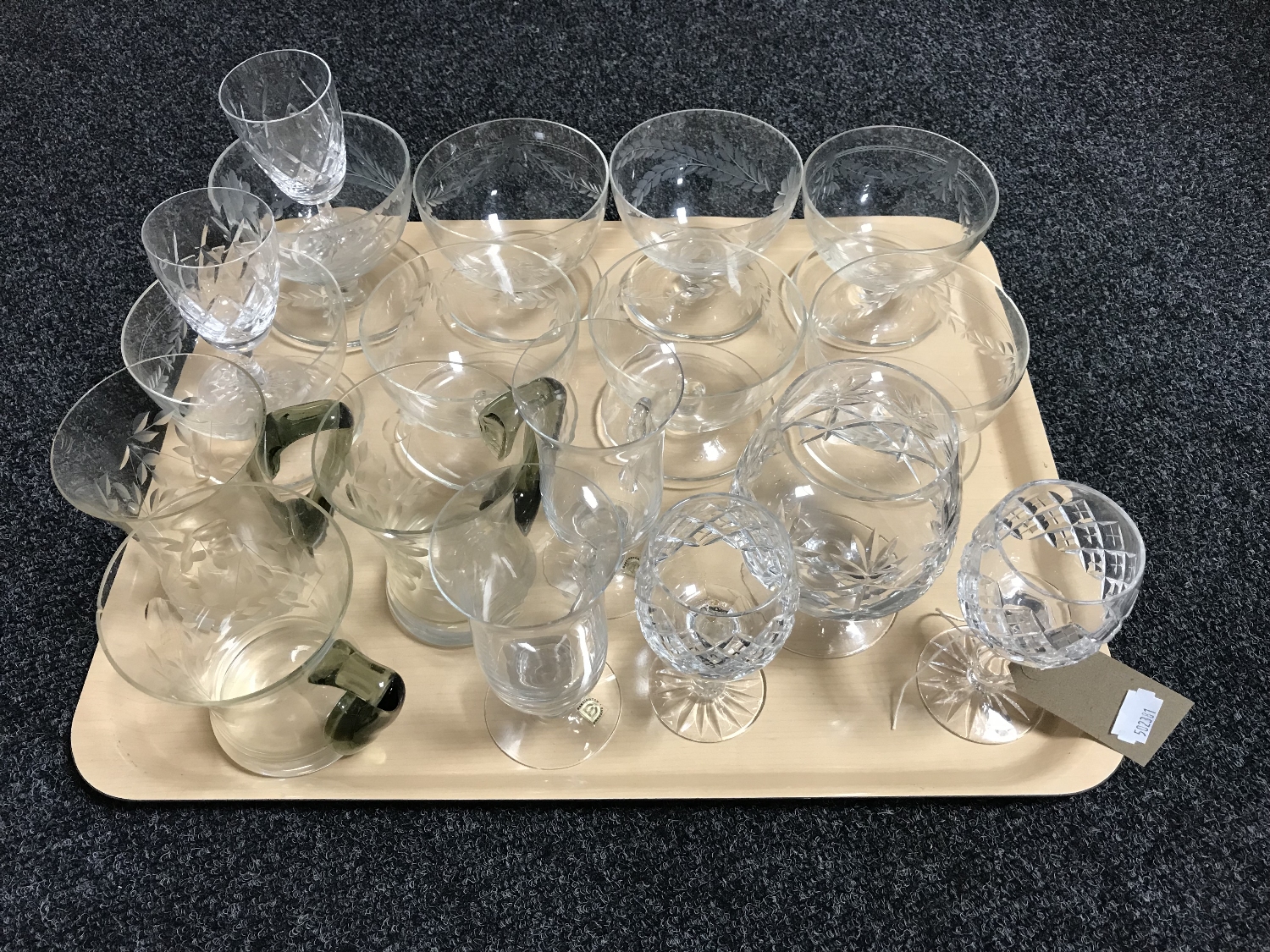 A tray of assorted drinking glasses,