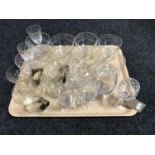 A tray of assorted drinking glasses,