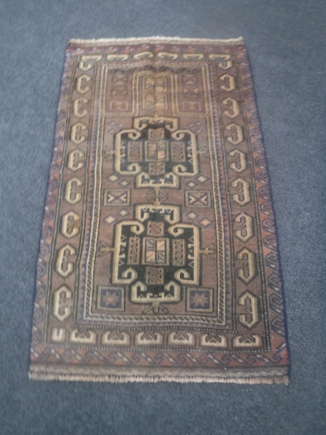 A Baluchi rug 135 cm x 80 cm