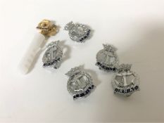 Eight modern Royal Navy badges and tie pins