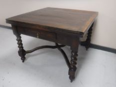 A Victorian oak pull out dining table on barley twist legs CONDITION REPORT: Total