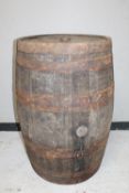 An antique oak coopered whisky barrel