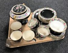 A tray containing thirty pieces of antique black and gilt rose patterned tea china together with