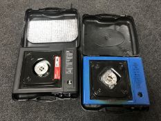 Two cased portable camping stoves