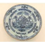An 18th/19th century Delft plate,