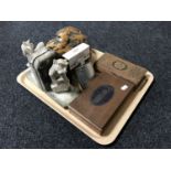 A tray containing a pair of pottery gargoyle bookends, polished piece of burr walnut,