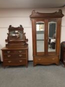 An Edwardian mahogany Art Nouveau mirror door wardrobe with matching mirror back dressing chest