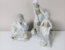 Three Nao figures; lady filling urn at well,