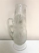 An antique etched glass jug depicting a stag in woodland CONDITION REPORT: In good