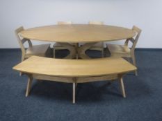 A contemporary oval dining table,