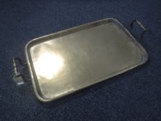 A brass Arts & Crafts twin-handled serving tray