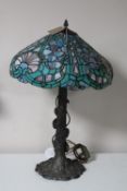 A Tiffany style table lamp with leaded glass shade
