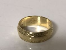 An 18ct gold band ring CONDITION REPORT: 3.