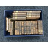 A box containing thirteen antique leather bound volumes; A Curious Collection of Travels,