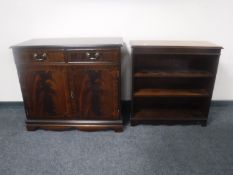 An inlaid mahogany Regency style double door sideboard and matching bookshelves