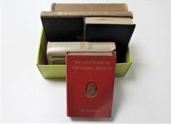 A box containing six 20th century volumes including The Seven Pillars of Wisdom by T. E.