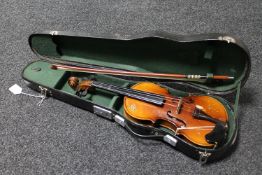A twentieth century half sized violin in case with bow