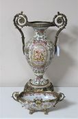 An ormolu mounted ewer (height 49 cm) with elaborate vine decoration together with the matching