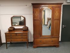 An Edwardian inlaid mahogany mirror door wardrobe with matching mirror back dressing chest