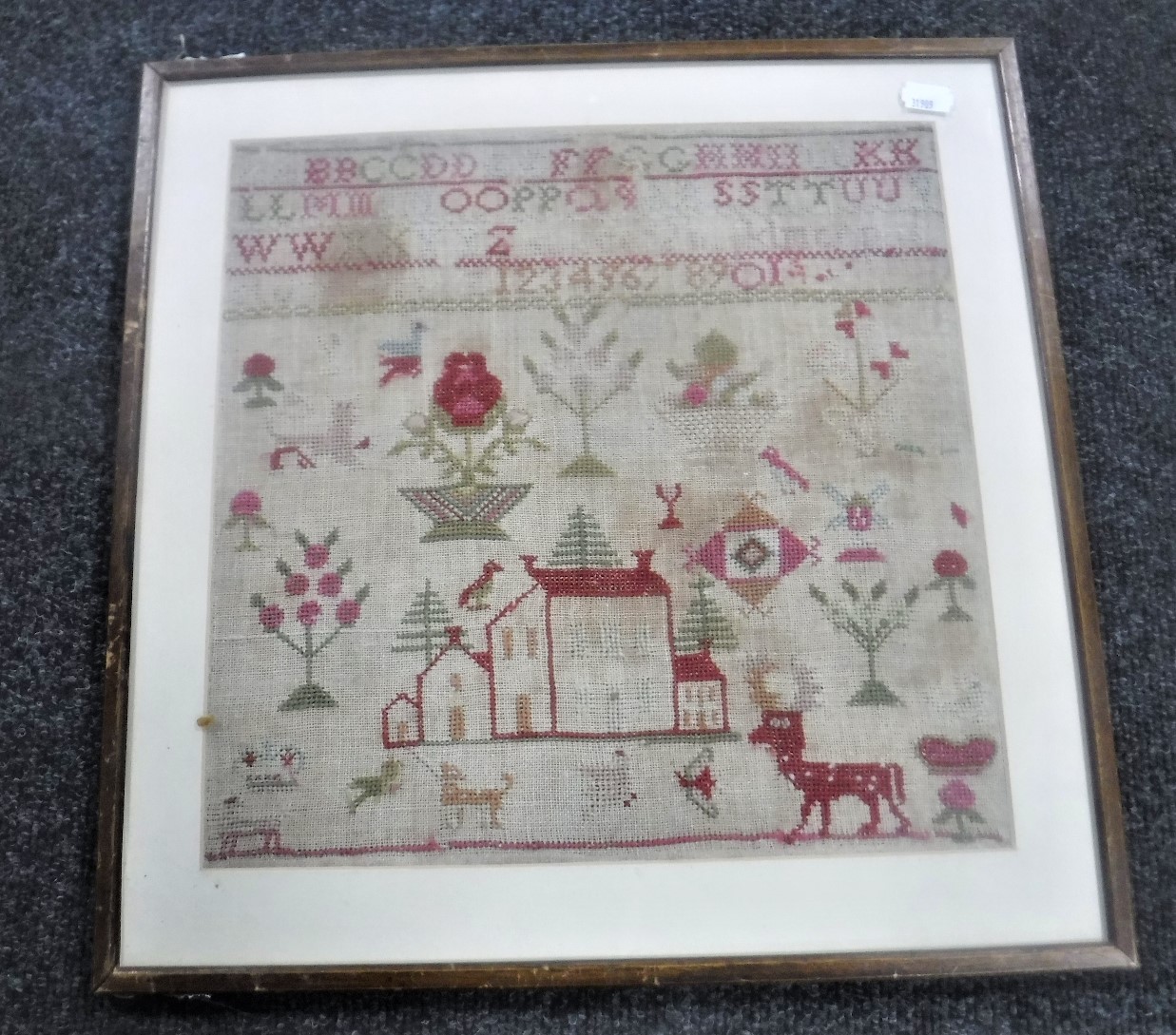 A 19th century framed alphabet sampler