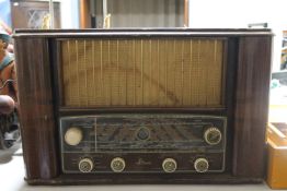 A mid 20th century walnut cased Mohawk 562 valve radio (continental wiring)