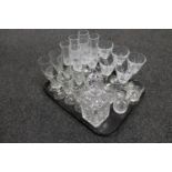 A tray of assorted glass ware to include a lead crystal whisky decanter together with three lead