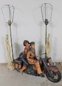 A wooden figure of an American sailor with girl on motorbike and two Eastern resin figural table