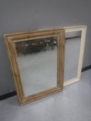 A pine framed mirror together with one other mirror