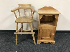 A pine child's high chair with foot rest together with a pine bedside cabinet