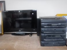 A Sanyo 32" LCD TV with remote together with a Sanyo hifi and speakers