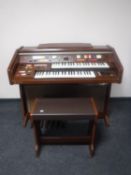 A Techincs PCM sound E44 electric organ with stool