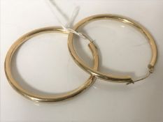 A pair of 9ct gold hoop earrings CONDITION REPORT: 4.