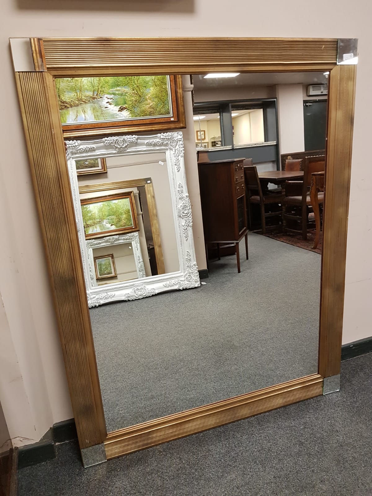 A contemporary overmantel mirror 110 cm x 140 cm