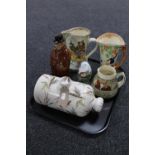 A tray containing antique and later pottery including a Royal Doulton Salmon Fisheries Jug,