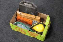 A box containing cased socket sets, drill bit accessory sets, hand saw,